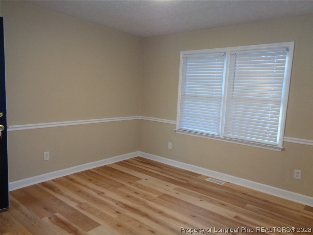 108 Dallas Street Lumberton, NC 28358 - Photo 7 of 15 an empty room with a window