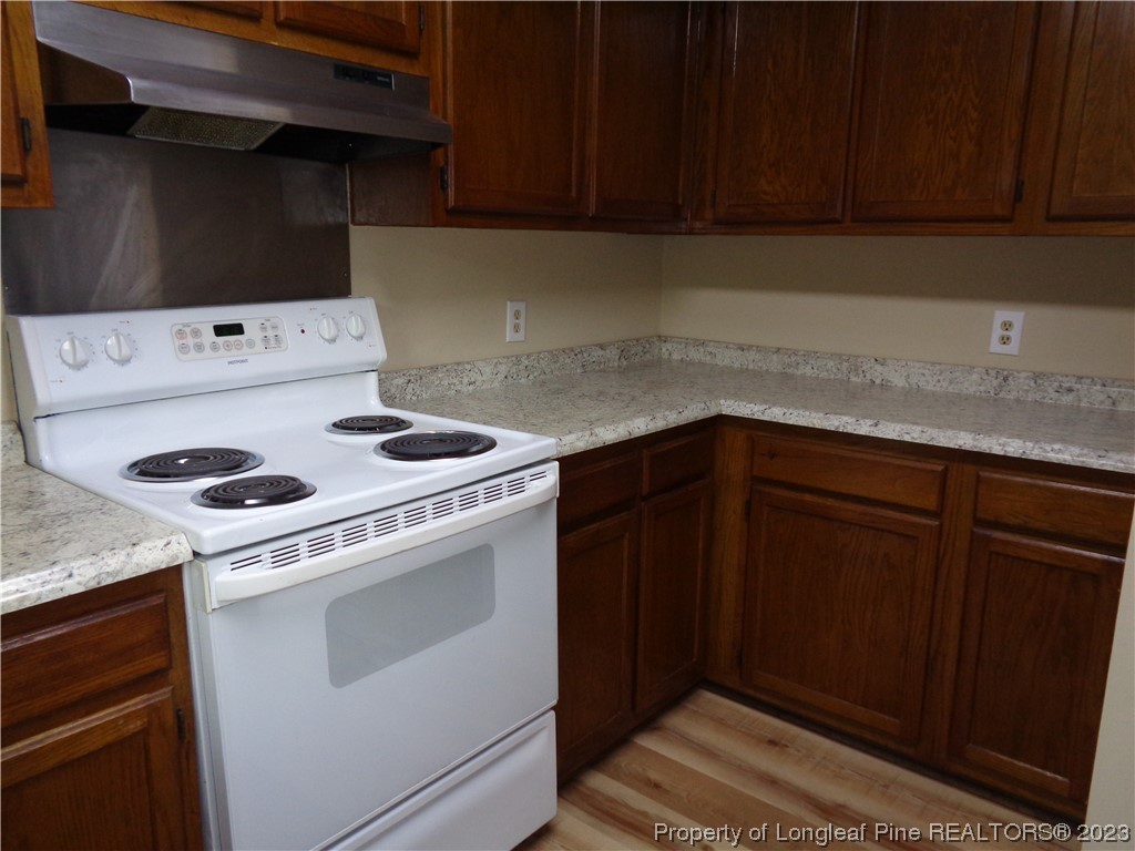 108 Dallas Street Lumberton, NC 28358 - Photo 9 of 15 a kitchen with a stove and cabinets