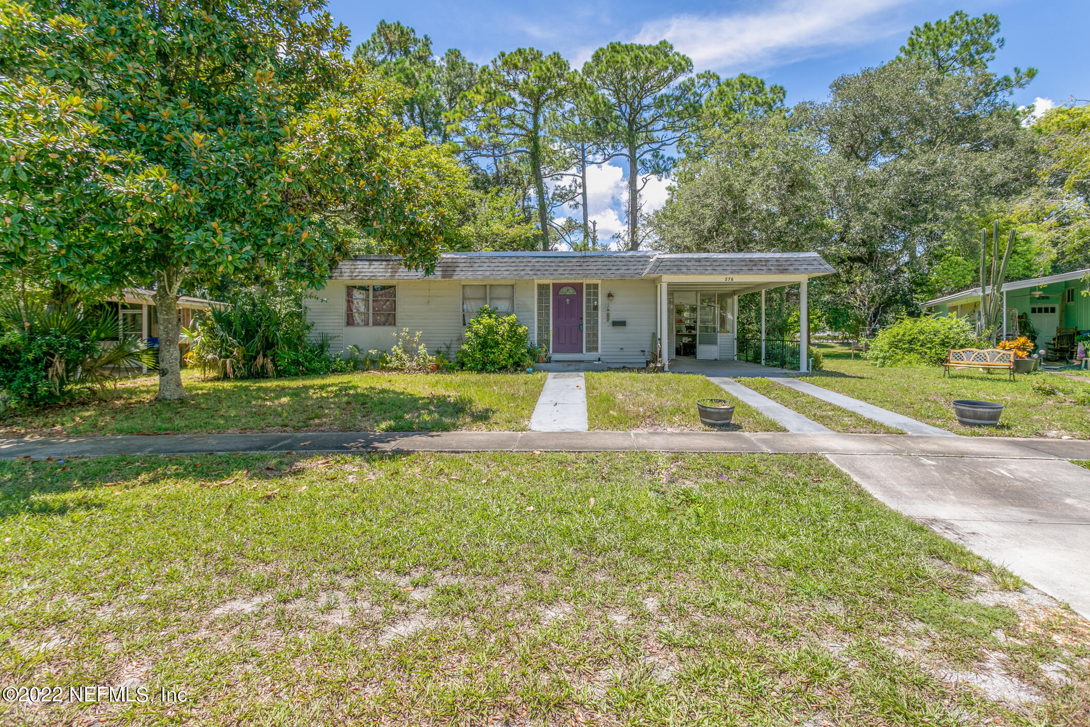876 Palermo Road St. Augustine, FL 32086 - Photo 3 of 56 a view of a house with a yard table and chairs