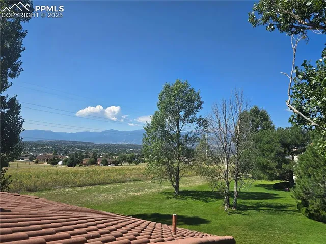 a view of a golf course with a lake