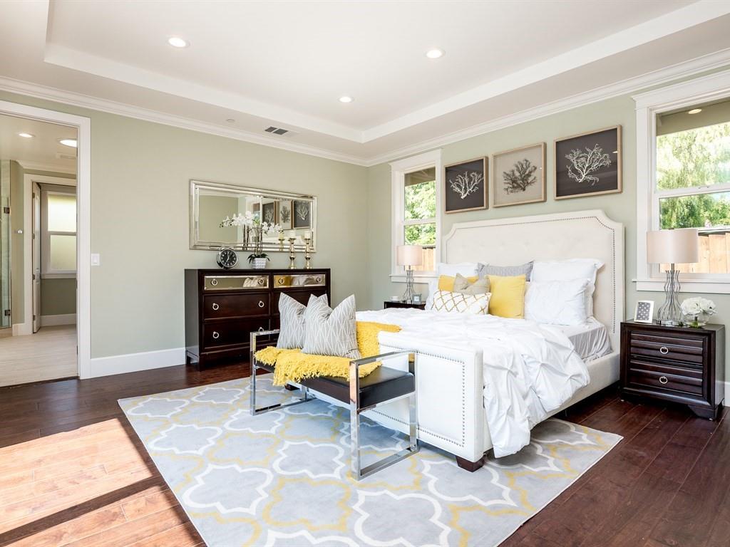 221 Cherry Lane Campbell, CA 95008 - Photo 14 of 23 a spacious bedroom with a bed and wooden floor