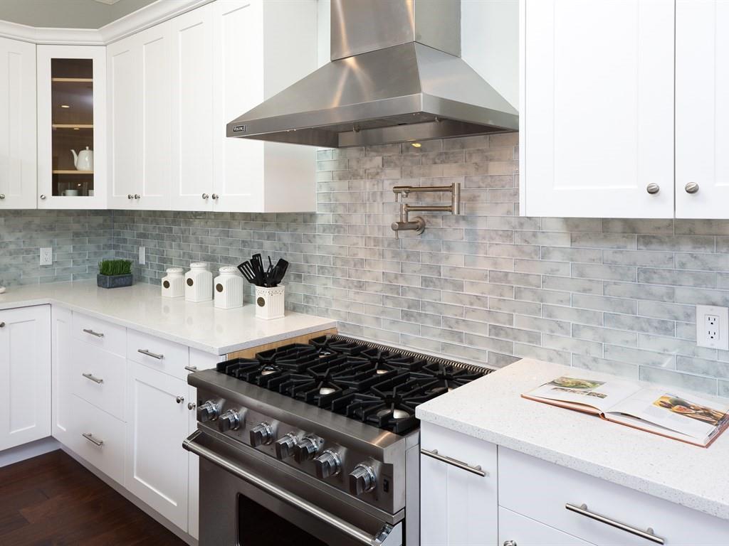 221 Cherry Lane Campbell, CA 95008 - Photo 9 of 23 a kitchen with a stove and white cabinets