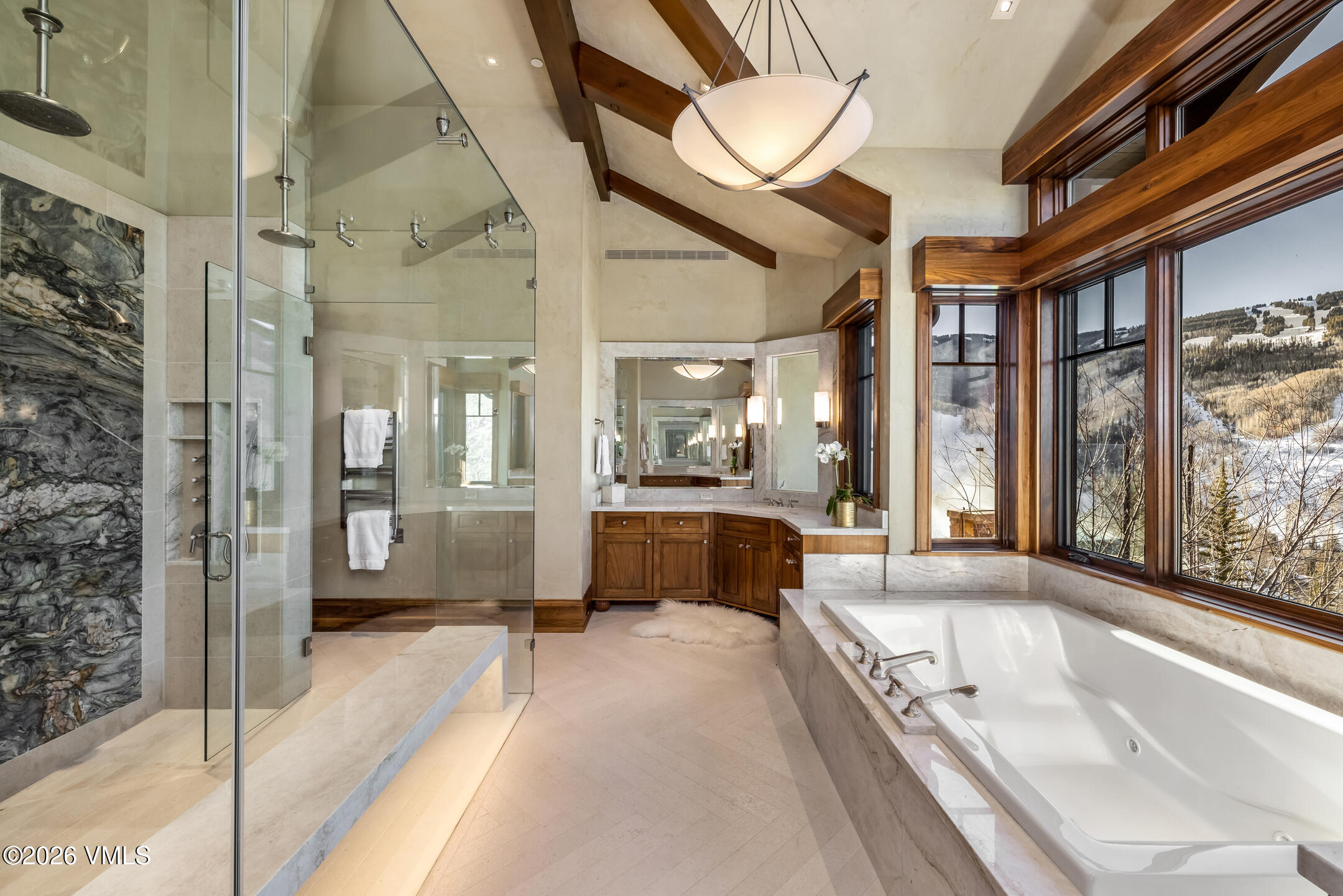 1000 Spraddle Creek Road Vail, CO 81657 - Photo 12 of 26 a large spacious bathroom with a large tub and shower
