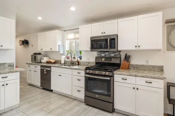 a view of a house with a snow in the yard