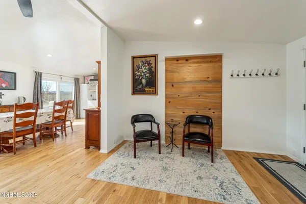 a view of a house with a wooden fence