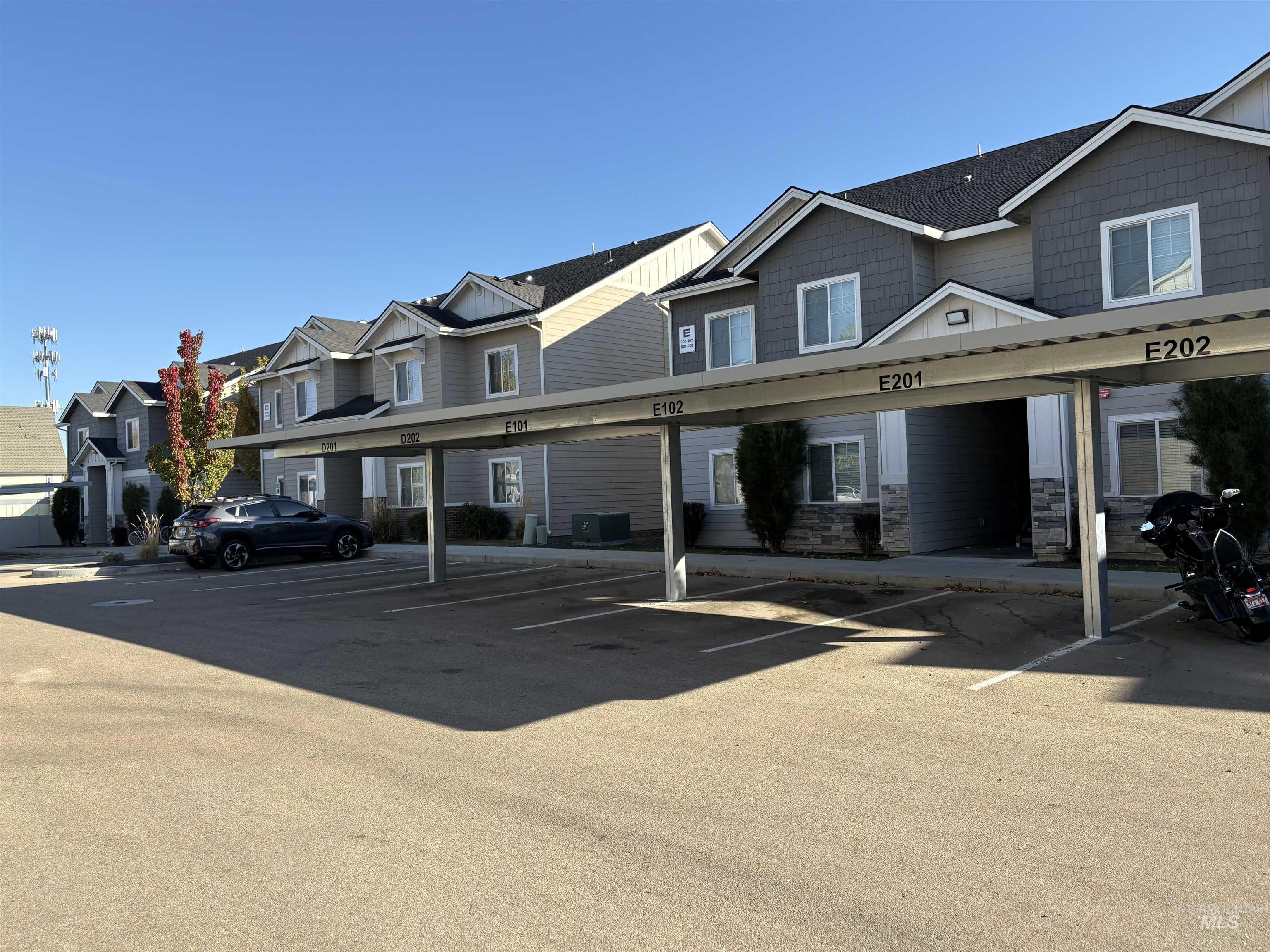 324 Northwest 3rd Street Meridian, ID 83642 - Photo 7 of 12 Covered parking lot featuring a residential view