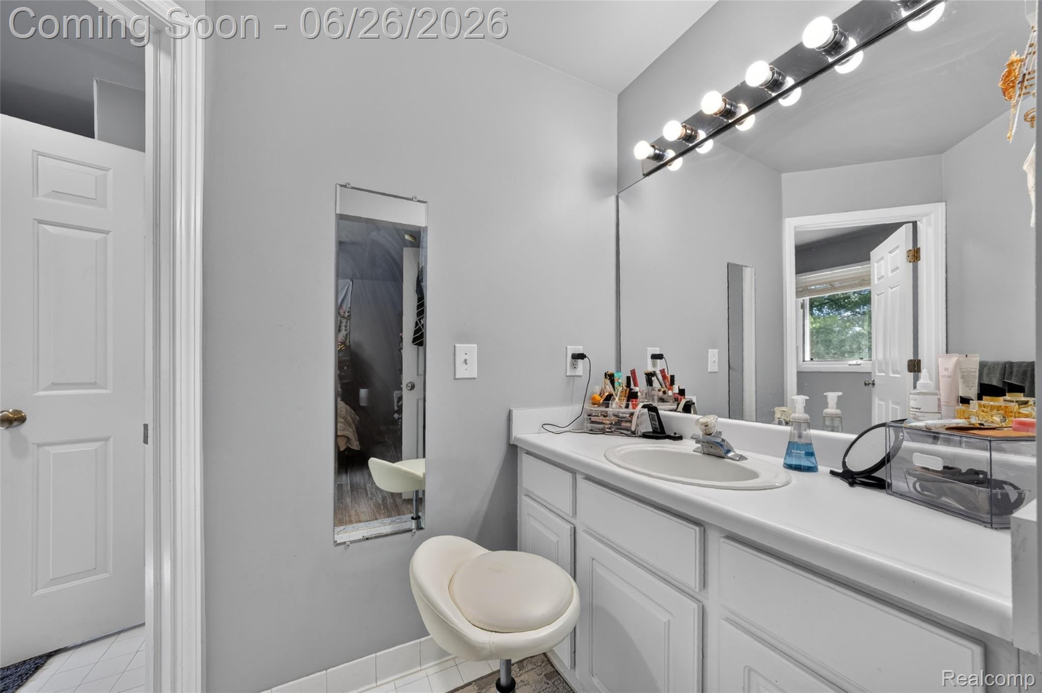 2619 Lambeth Park Rochester, MI 48306 - Photo 40 of 71 Bathroom featuring a vanity with an integrated sink, white cabinetry, and a large wall-mounted mirror
