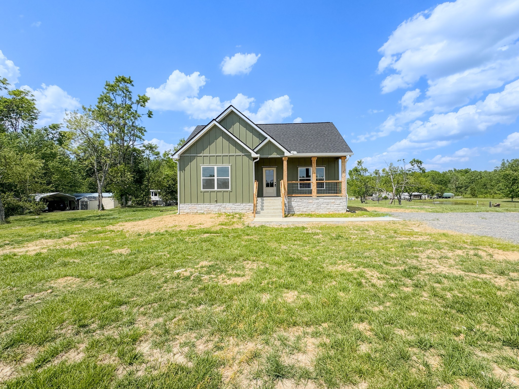181 Rock House Hollow Road Bethpage, TN 37022 - Photo 4 of 51 a front view of a house with a yard