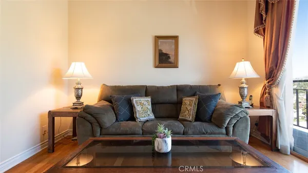 a living room with furniture and a lamp