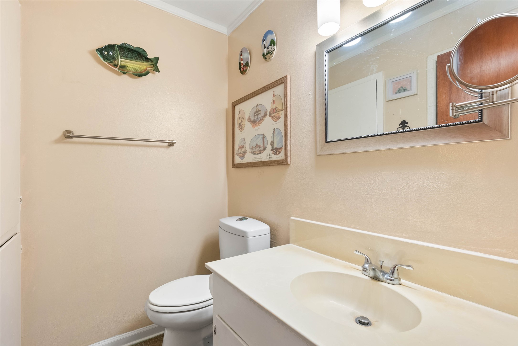 168 Sunset Ingleside, TX 78362 - Photo 18 of 26 Neat and tidy half-bath/powder room featuring a crisp vanity and mirror setup.