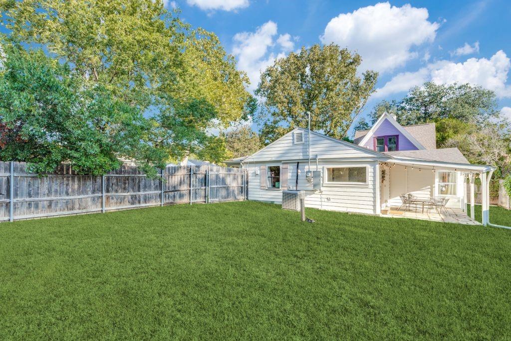 802 Broad Street McKinney, TX 75069 - Photo 12 of 12 a front view of a house with a garden