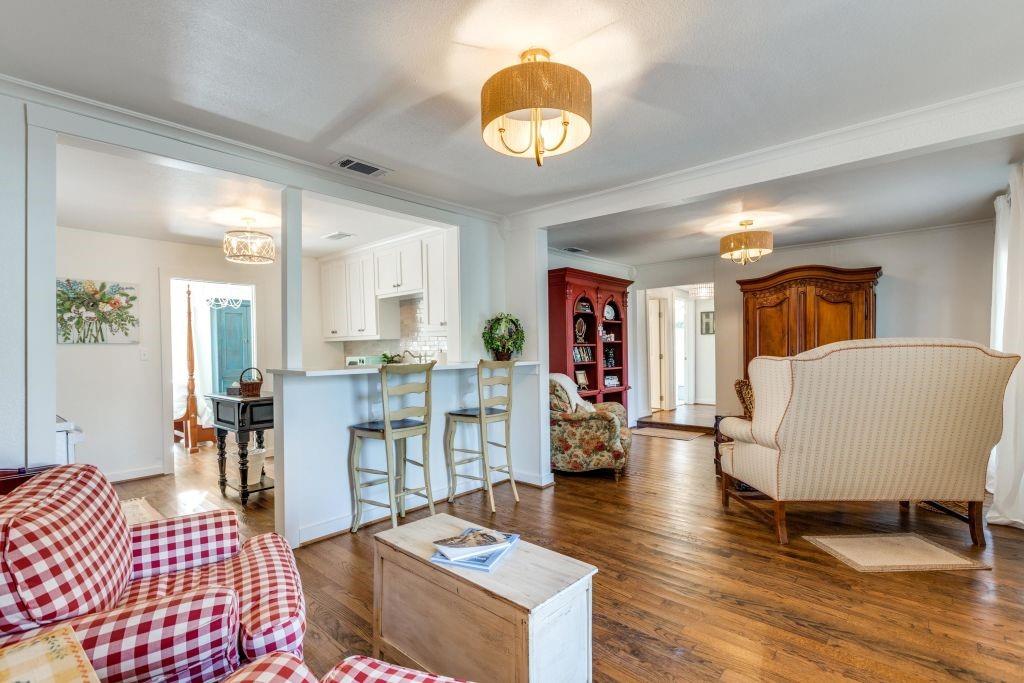 802 Broad Street McKinney, TX 75069 - Photo 2 of 12 a living room with furniture and a table