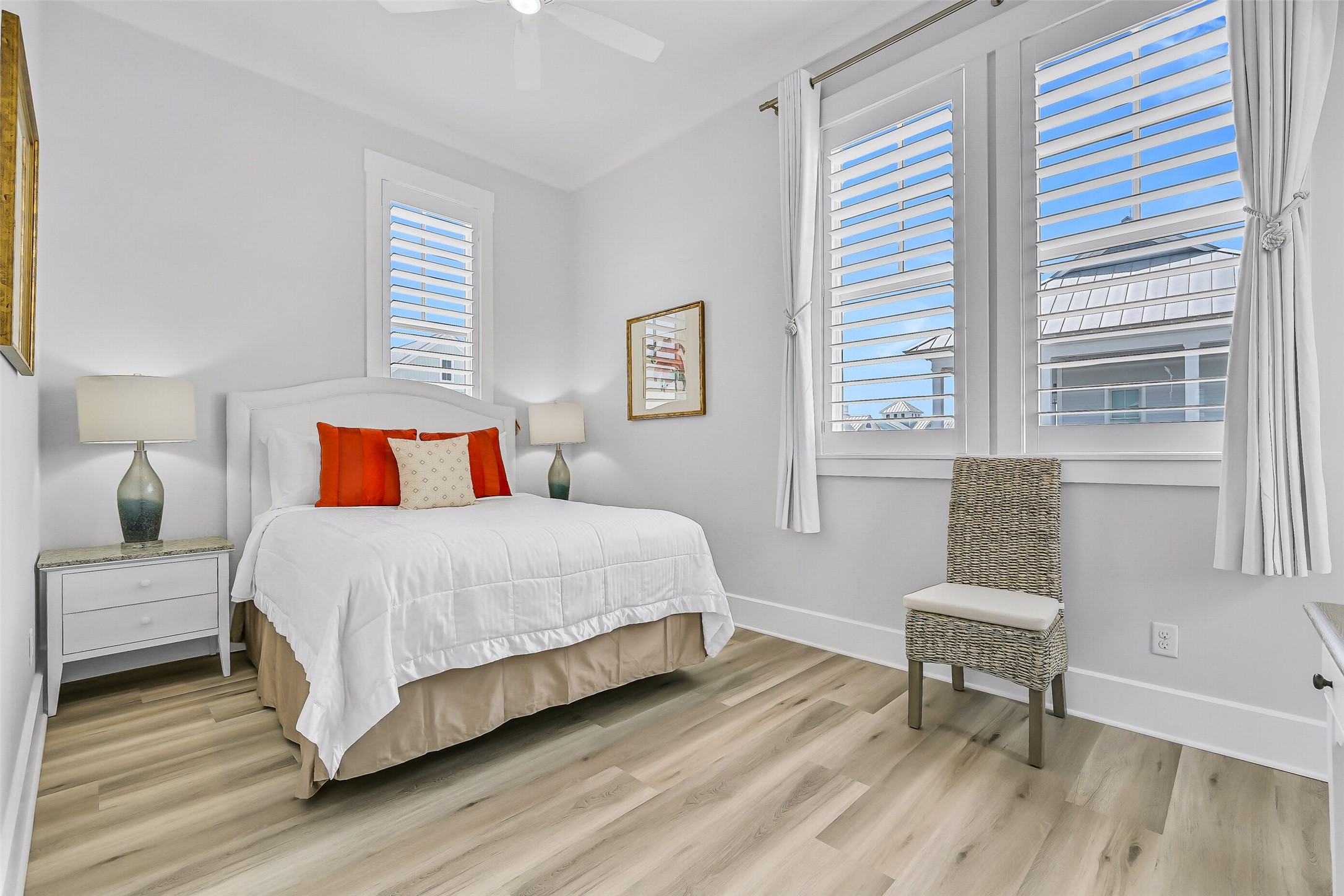 817 Positano Road Galveston, TX 77550 - Photo 36 of 50 Bright, cheerful, and recently refreshed, this bedroom offers a comfortable retreat for family and friends. New beach-inspired flooring, updated furnishings, and large windows fill the space with natural light and coastal charm.