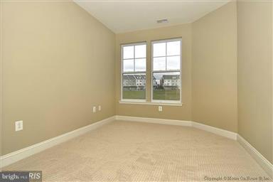 12824 Clarksburg Square Road, Unit 208 Clarksburg, MD 20871 - Photo 12 of 20 an empty room with a window