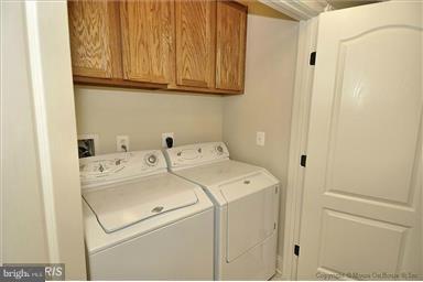 12824 Clarksburg Square Road, Unit 208 Clarksburg, MD 20871 - Photo 13 of 20 a utility room with dryer and washer