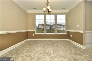12824 Clarksburg Square Road, Unit 208 Clarksburg, MD 20871 - Photo 8 of 20 a view of an empty room with a window