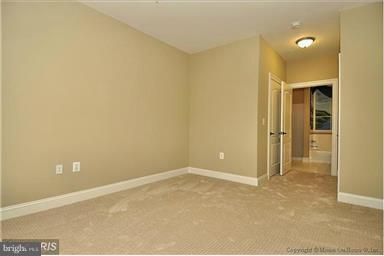 12824 Clarksburg Square Road, Unit 208 Clarksburg, MD 20871 - Photo 9 of 20 an empty room with closet area
