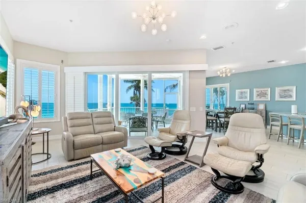 a living room with furniture or couch and a large window