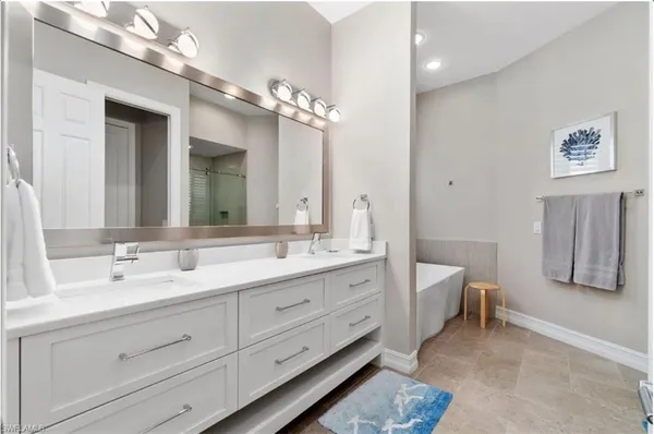 a bathroom with a bathtub and shower