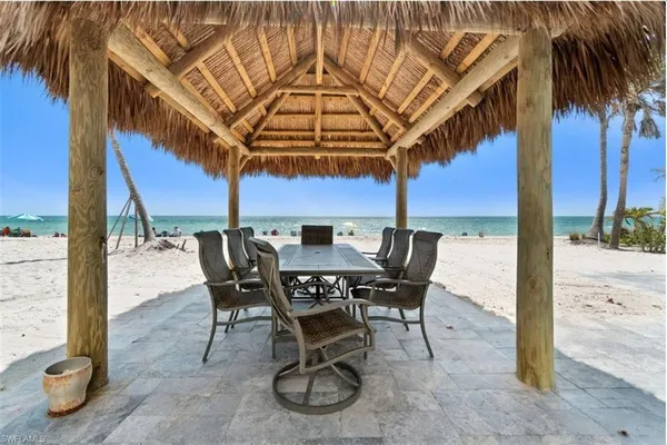 a front view of a building with a garden and pathway