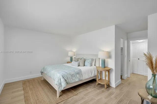 a bedroom with a bed and a table