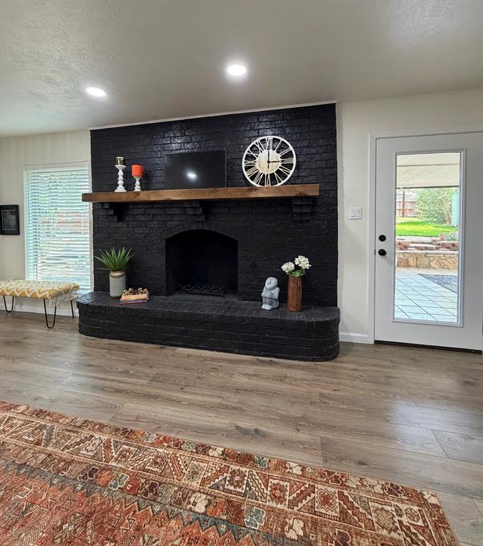 3609 Country Club Road Arlington, TX 76013 - Photo 10 of 40 a living room with furniture and a fireplace