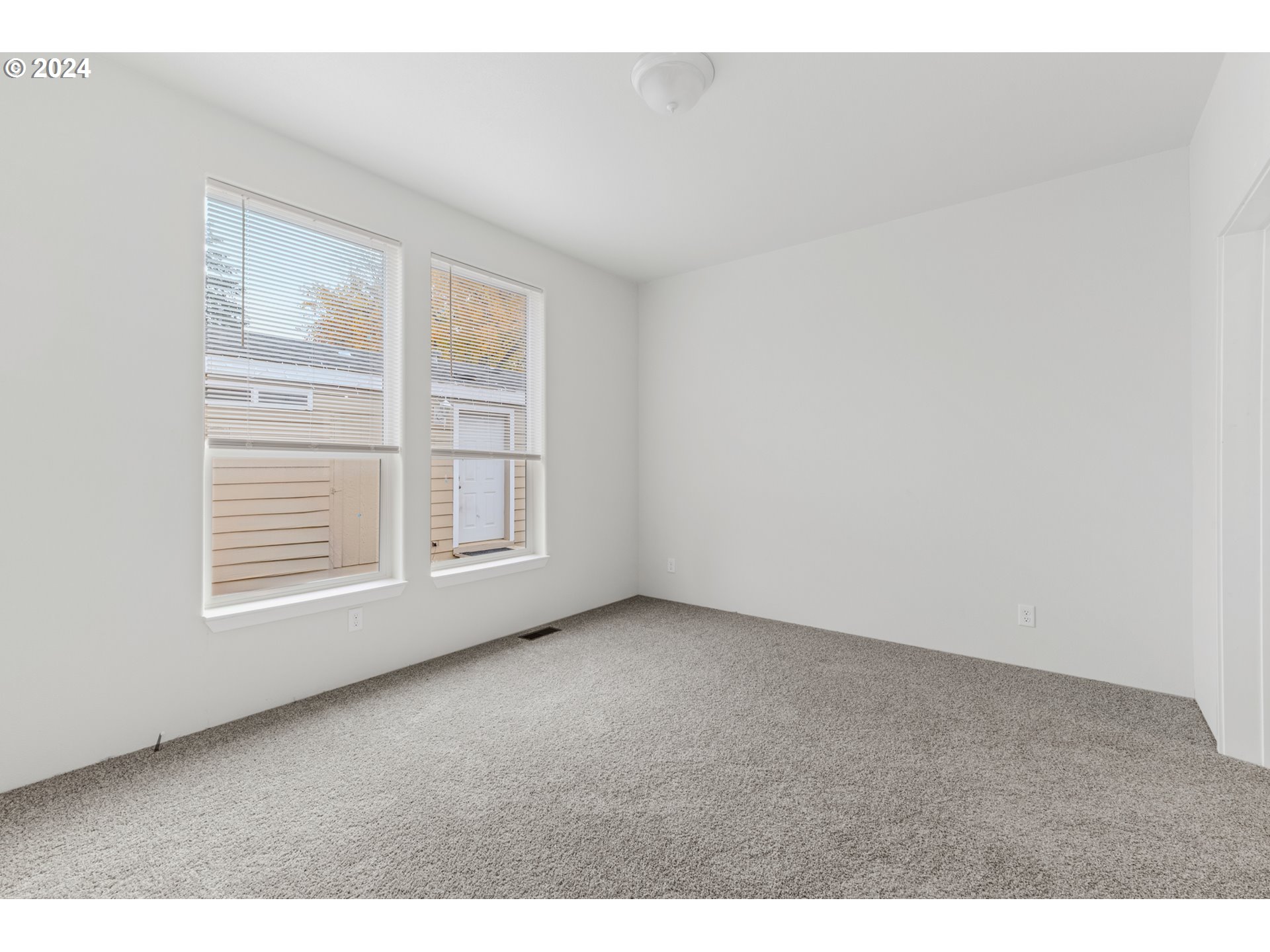 9700 Southwest Tualatin Road, Unit 22 Tualatin, OR 97062 - Photo 19 of 30 a view of an empty room with a window