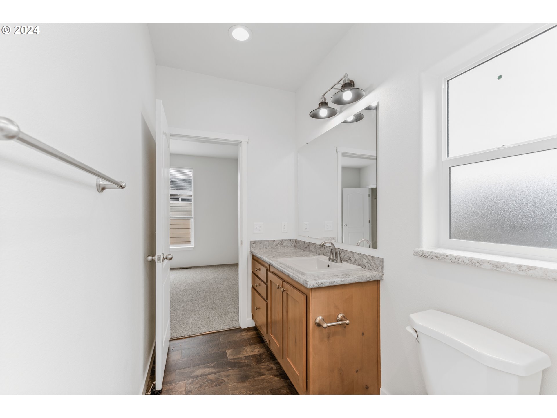 9700 Southwest Tualatin Road, Unit 22 Tualatin, OR 97062 - Photo 23 of 30 a bathroom with a sink a mirror and a shower