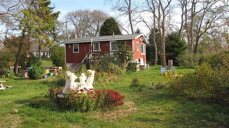 4 Pond Road, Unit 1 2 3 Truro, MA 02666 - Photo 18 of 19 a view of a house with yard and a garden