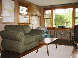 4 Pond Road, Unit 1 2 3 Truro, MA 02666 - Photo 19 of 19 a living room with furniture and a large window