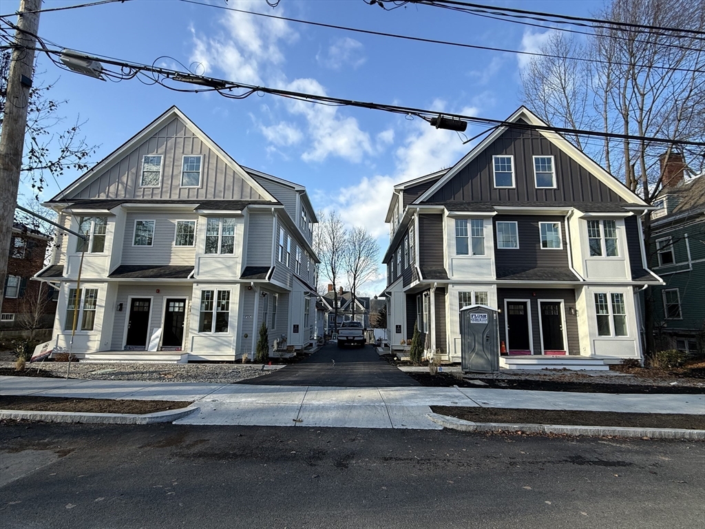 49 Chase Street, Unit 3 Newton, MA 02459 - Photo 2 of 12 a view of a big house with a street