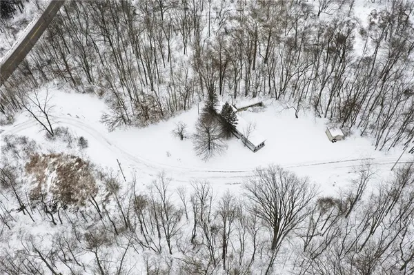 a view of snow on the road