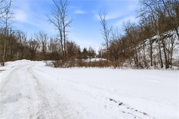 a view of snow covered with snow in front of house