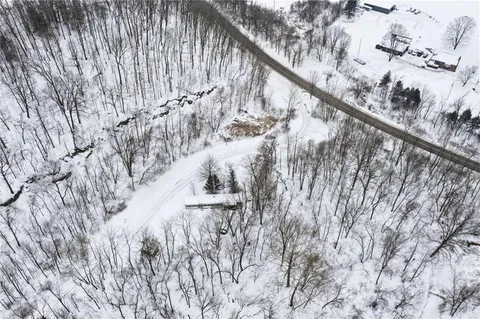 a view of mountain view with trees in background