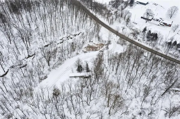 a view of mountain view with trees in background