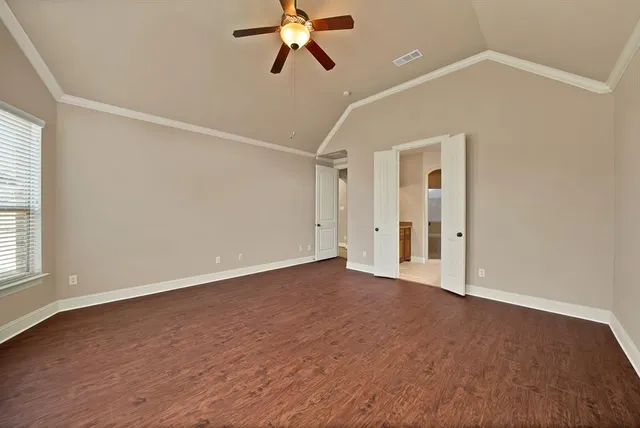 a view of an empty room with a window