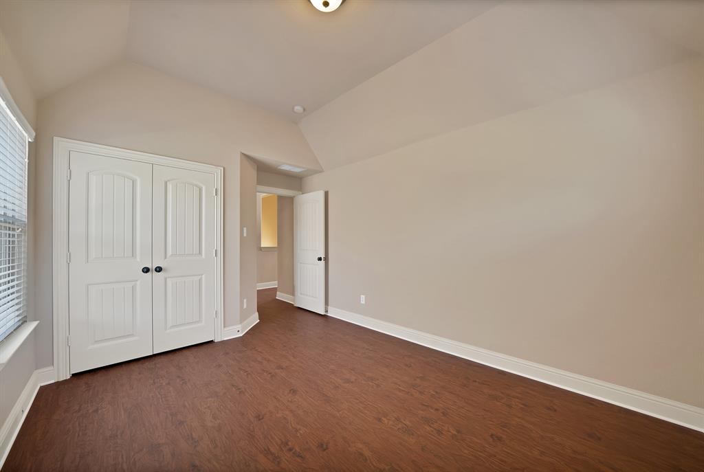 7315 Comal Drive Irving, TX 75039 - Photo 22 of 27 a view of an empty room and wooden floor