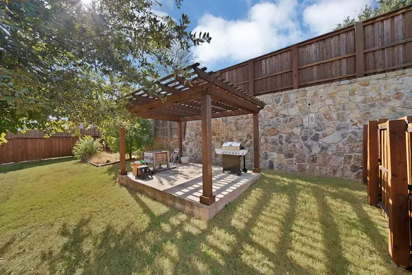 a view of a backyard with a patio