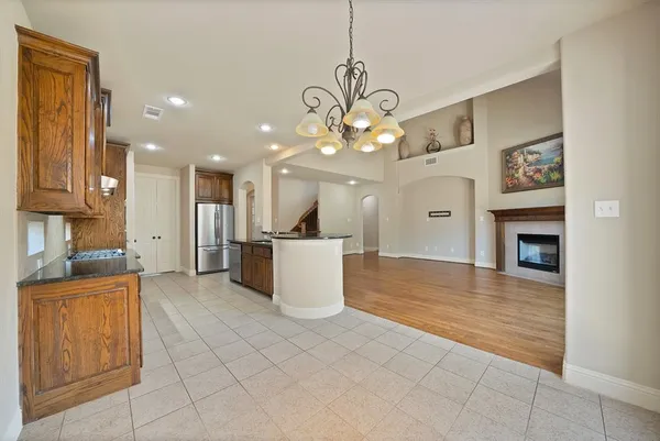 a view of a kitchen with a sink and a kitchen floor