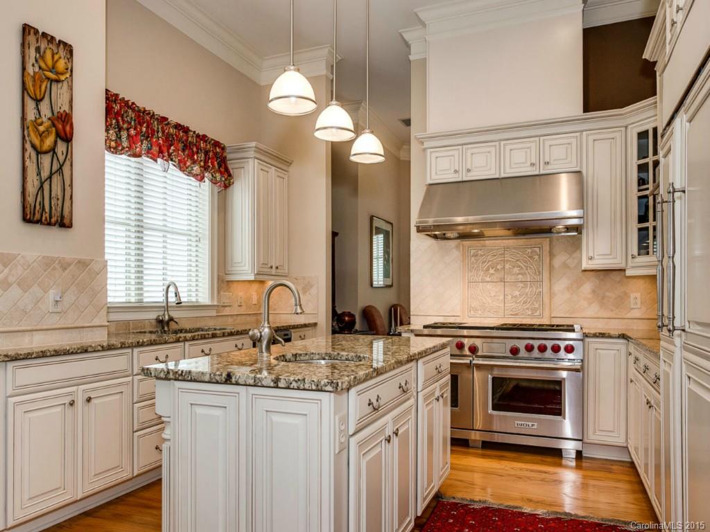 2823 Providence Road, Unit 180 Charlotte, NC 28211 - Photo 11 of 24 a kitchen with granite countertop a stove and a sink