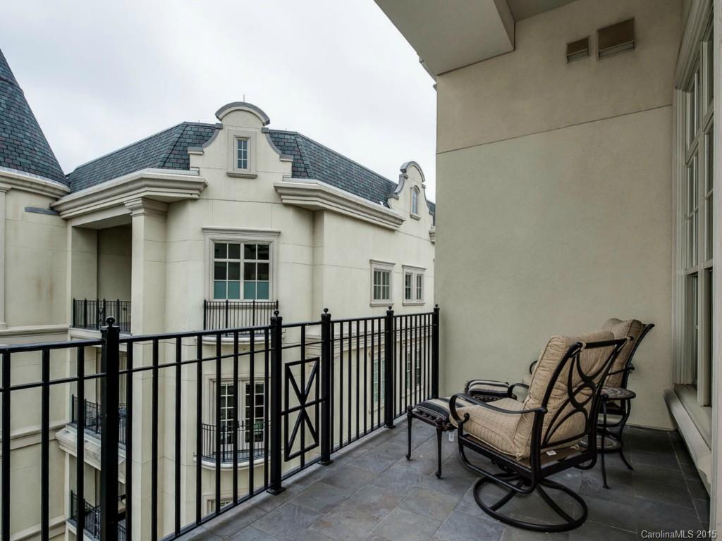 2823 Providence Road, Unit 180 Charlotte, NC 28211 - Photo 15 of 24 a view of a white house with iron fence