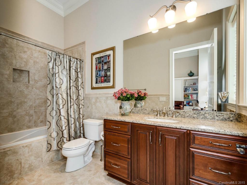 2823 Providence Road, Unit 180 Charlotte, NC 28211 - Photo 20 of 24 a bathroom with a granite countertop sink toilet and shower