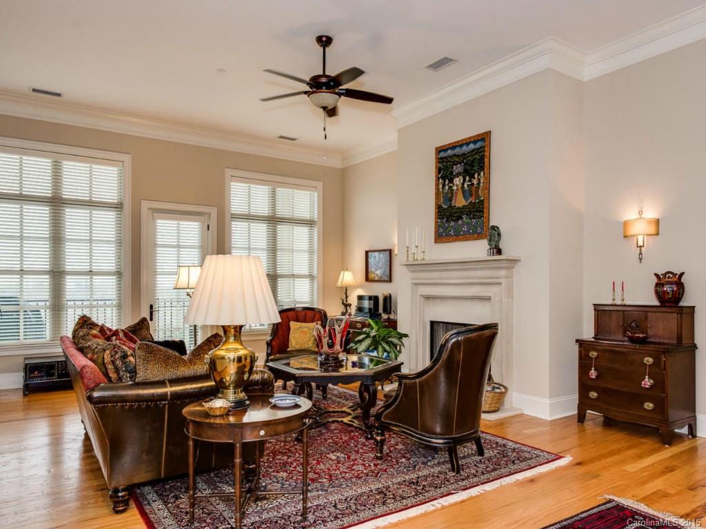 2823 Providence Road, Unit 180 Charlotte, NC 28211 - Photo 8 of 24 a living room with furniture a fireplace and a window