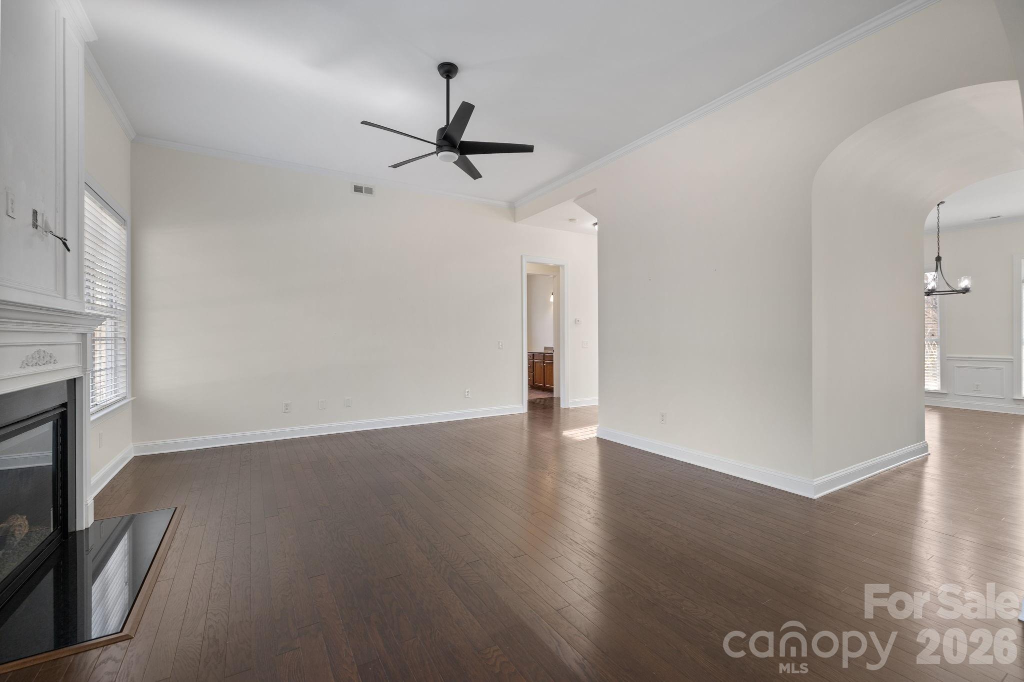 646 Quicksilver Trail Fort Mill, SC 29708 - Photo 13 of 48 a view of empty room with wooden floor and fan
