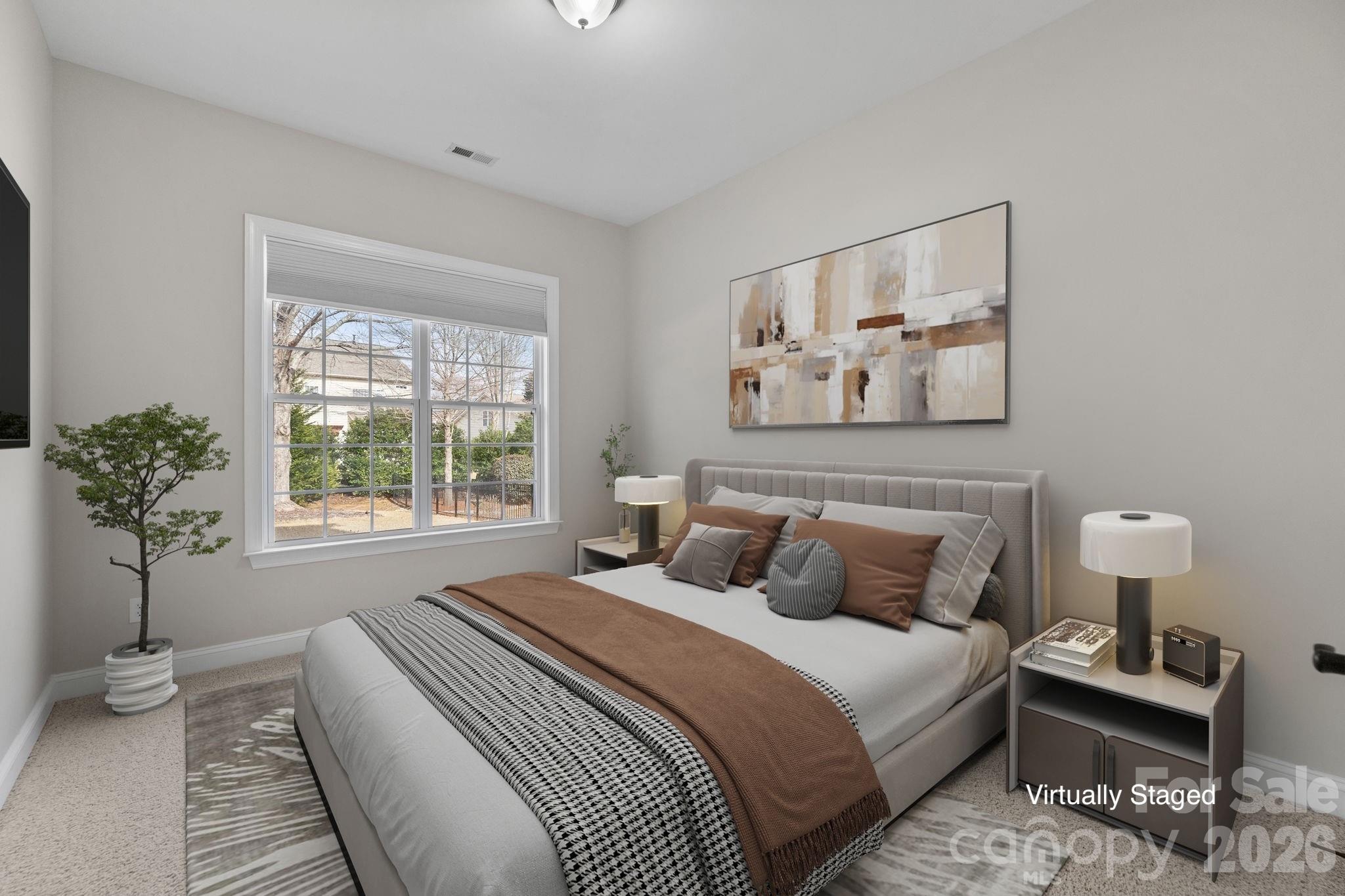 646 Quicksilver Trail Fort Mill, SC 29708 - Photo 20 of 48 a bedroom with bed and a potted plant