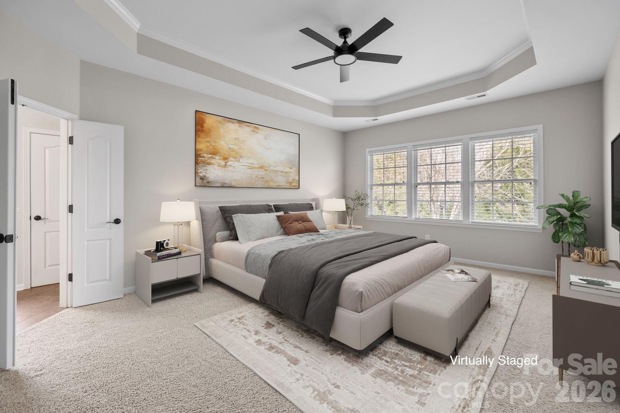646 Quicksilver Trail Fort Mill, SC 29708 - Photo 33 of 48 a bedroom with a large bed and a couch