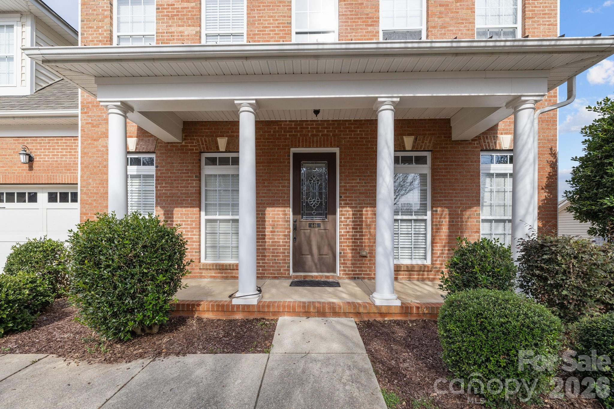 646 Quicksilver Trail Fort Mill, SC 29708 - Photo 42 of 48 a view of a brick house with potted plants