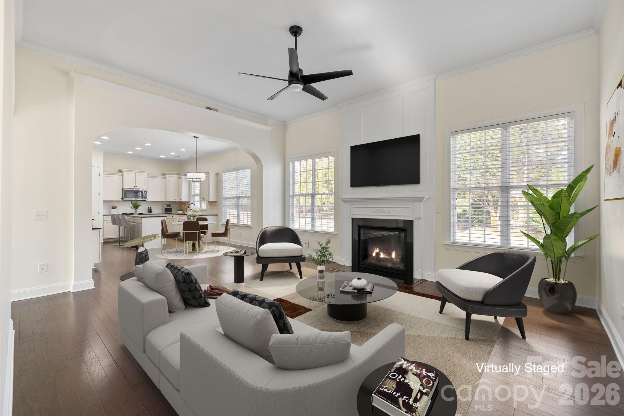 646 Quicksilver Trail Fort Mill, SC 29708 - Photo 10 of 48 a living room with furniture a fireplace and a flat screen tv