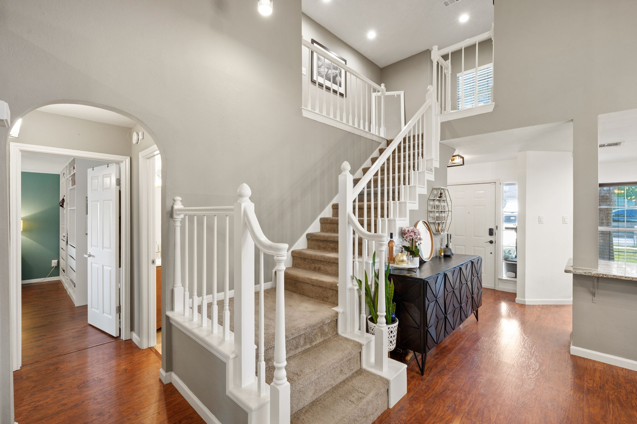 705 Canyon Bend Road Pflugerville, TX 78660 - Photo 14 of 23 a view of entryway with wooden floor and stairs