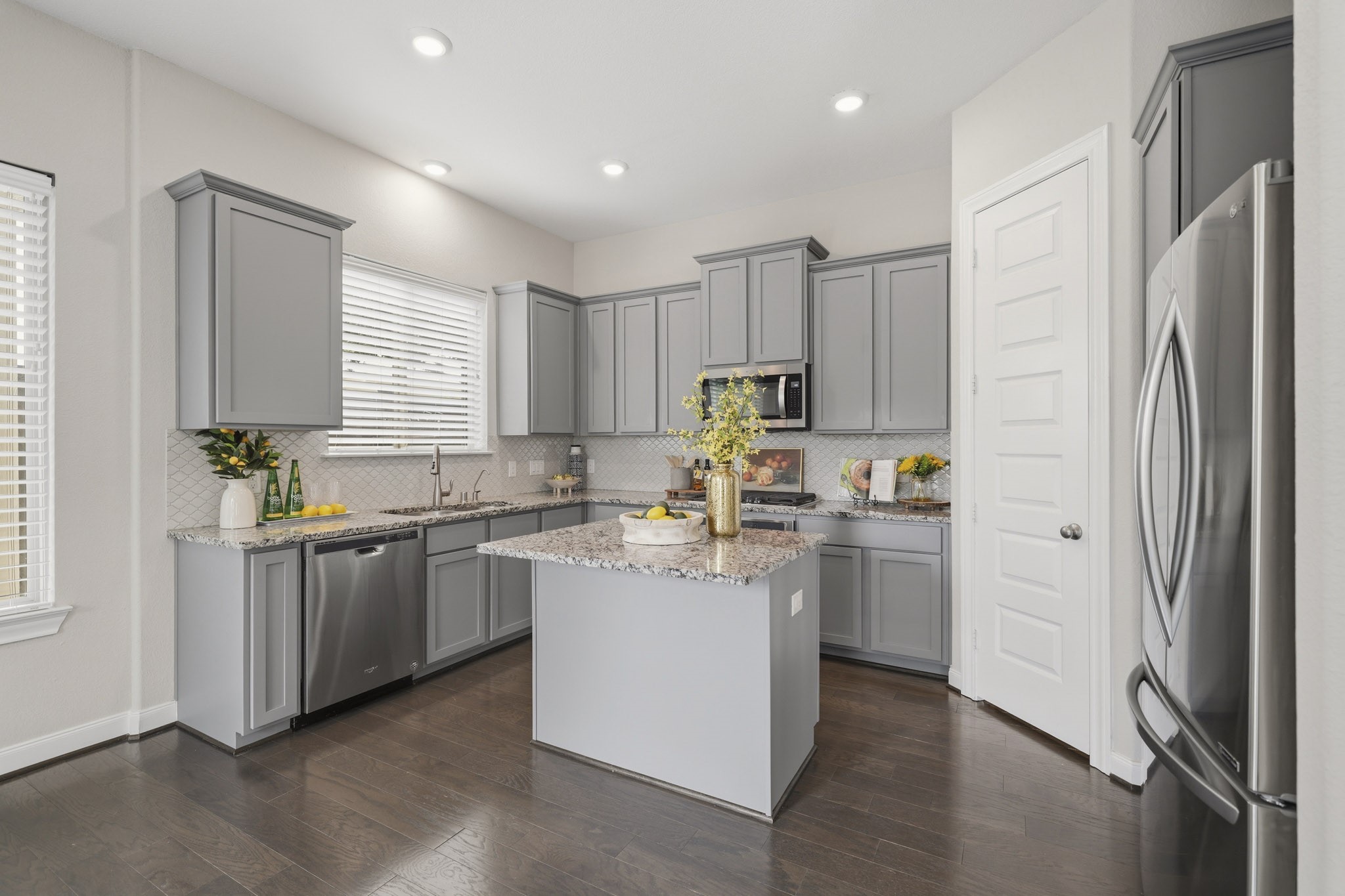 4103 Tranquil Square Road Houston, TX 77043 - Photo 12 of 39 Elegant granite counters and an eye-catching arabesque back splash provide a polished backdrop for everyday cooking and entertaining.